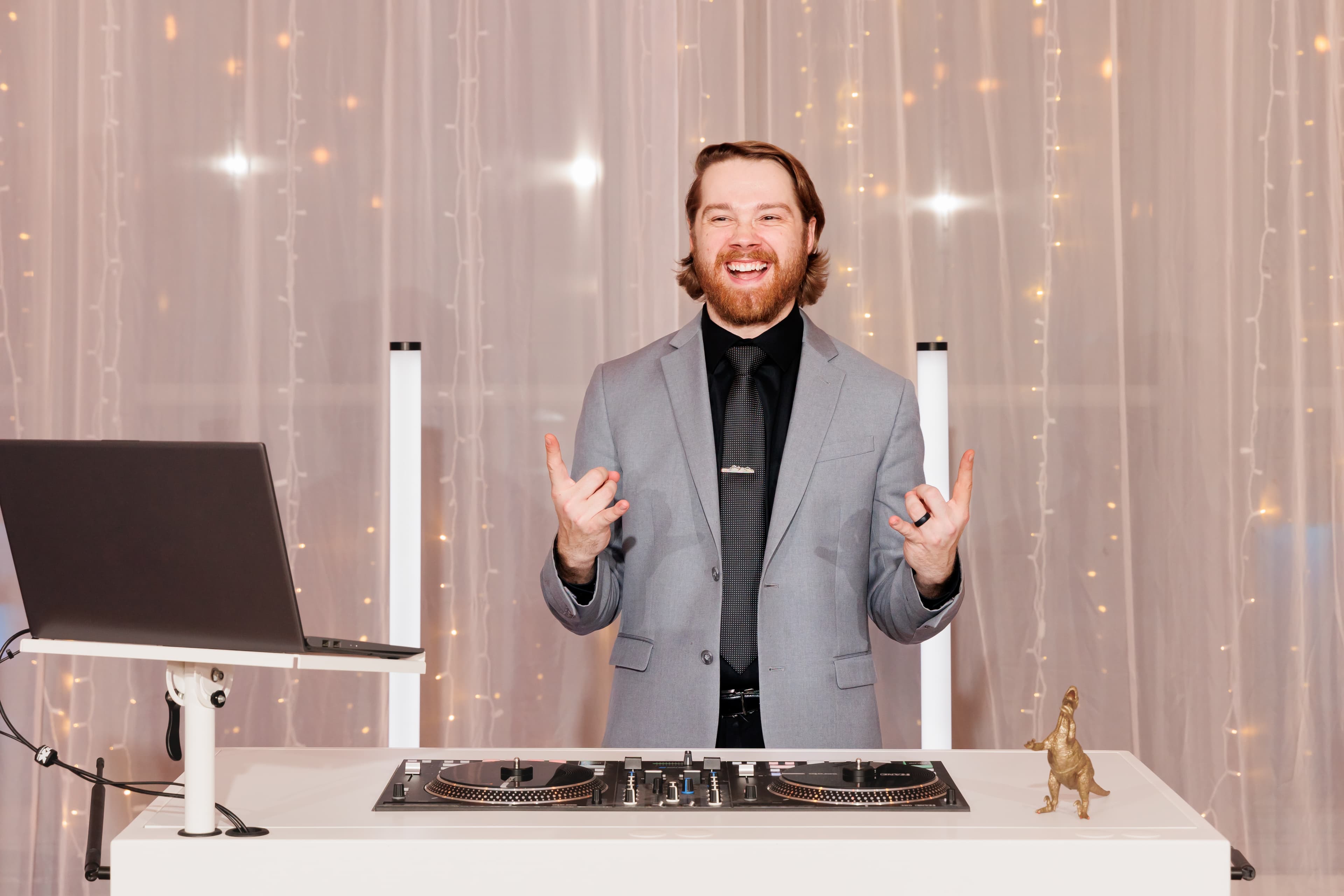 Noah DeVoe mixing at a wedding reception booth